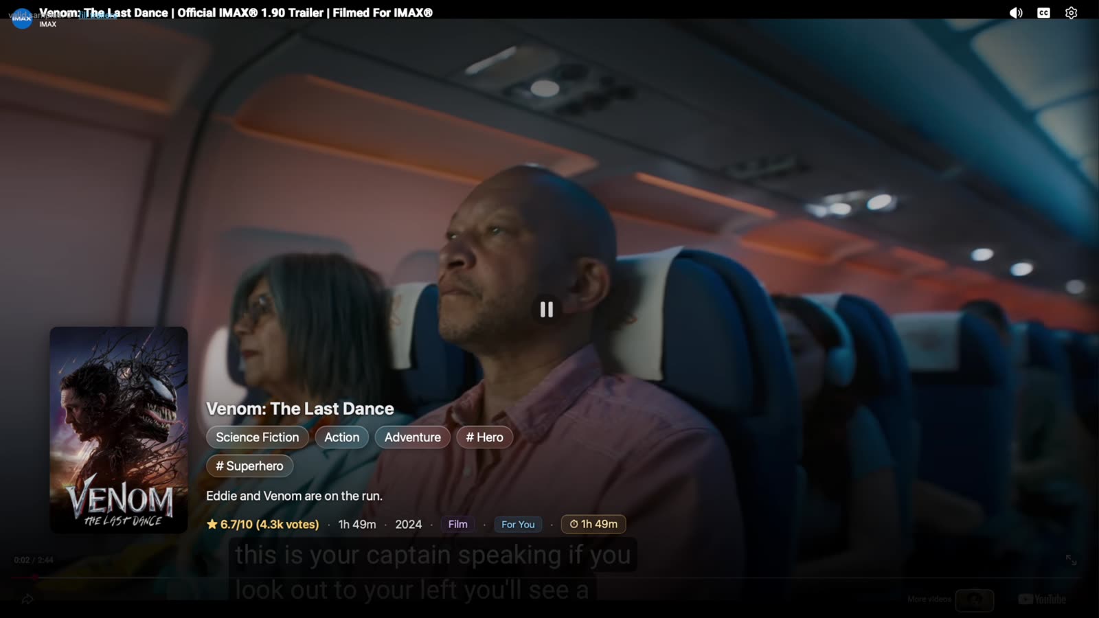 A trailer playing full-screen with the title, genre tags and synopsis over it